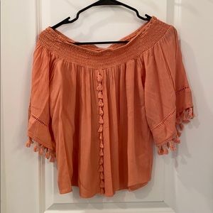Fun coral off the shoulder top with tassels